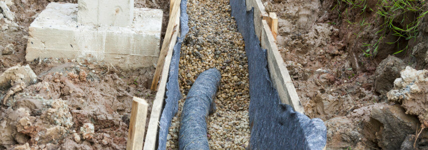 erosion control around house foundation - french drain covered in gravel
