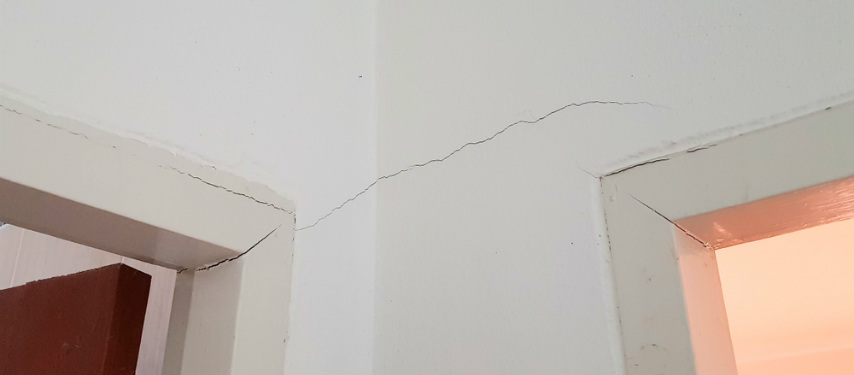 door frame pulling away from wall